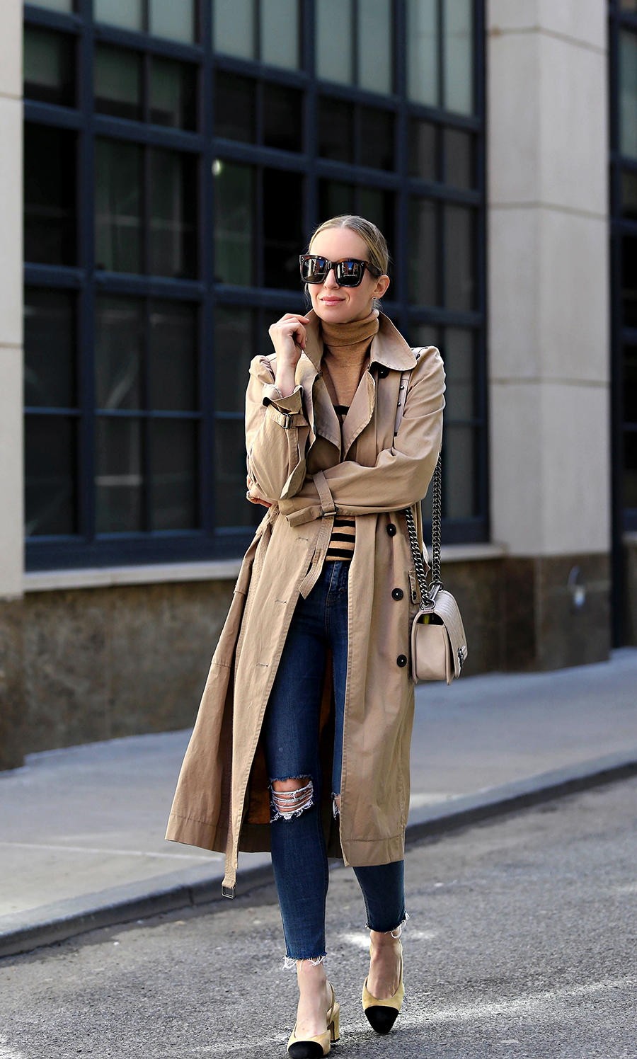 woman wearing trench coat for everyone, striped top and jeans