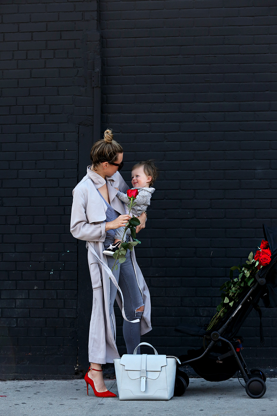 Helena of Brooklyn Blonde wearing a grey monochromatic outfit with Topshop long grey duster jacket, red Aquazzura heels, Senreve bag, MONROW tee, MICHELE watch