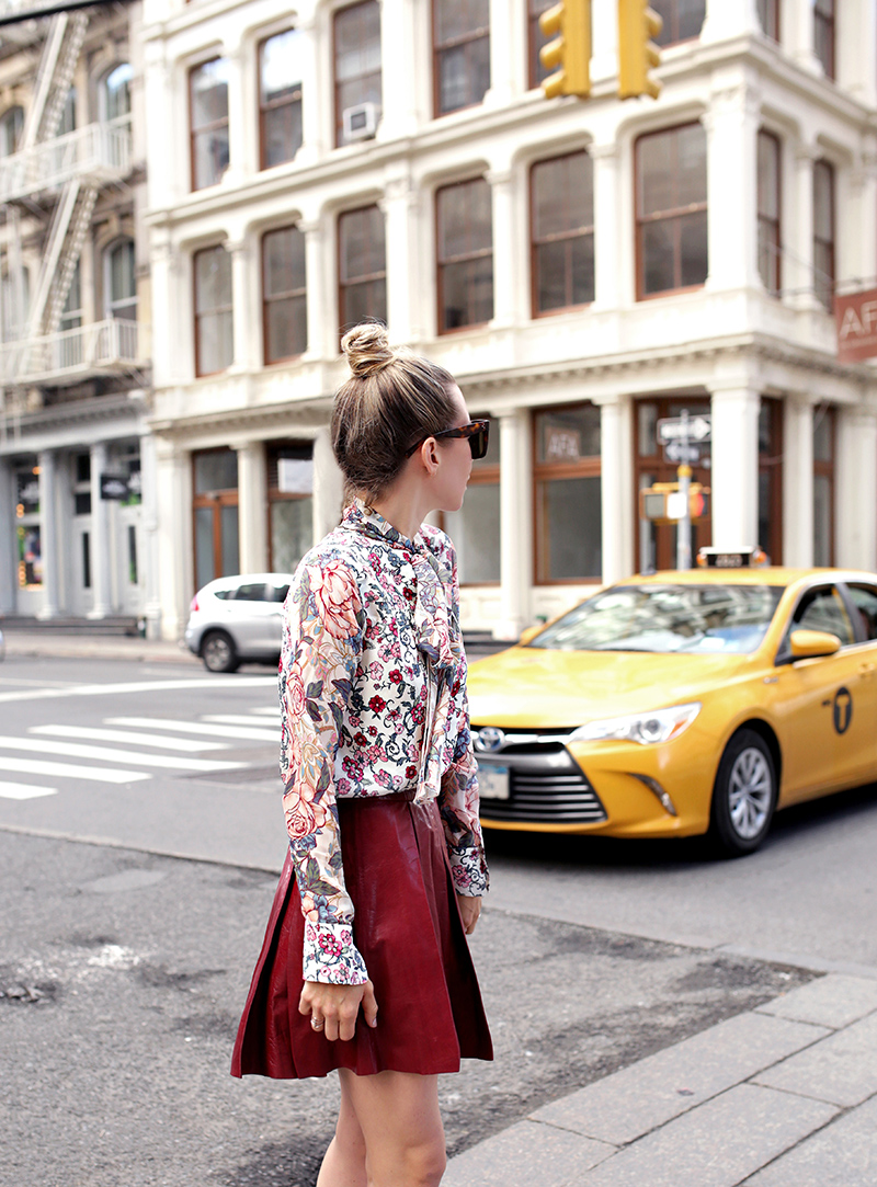 Helena Glazer of Brooklyn Blonde wearing See by Chloe floral top, Alice + Olivia maroon Leather Skirt, Manolo Blahnik shoes