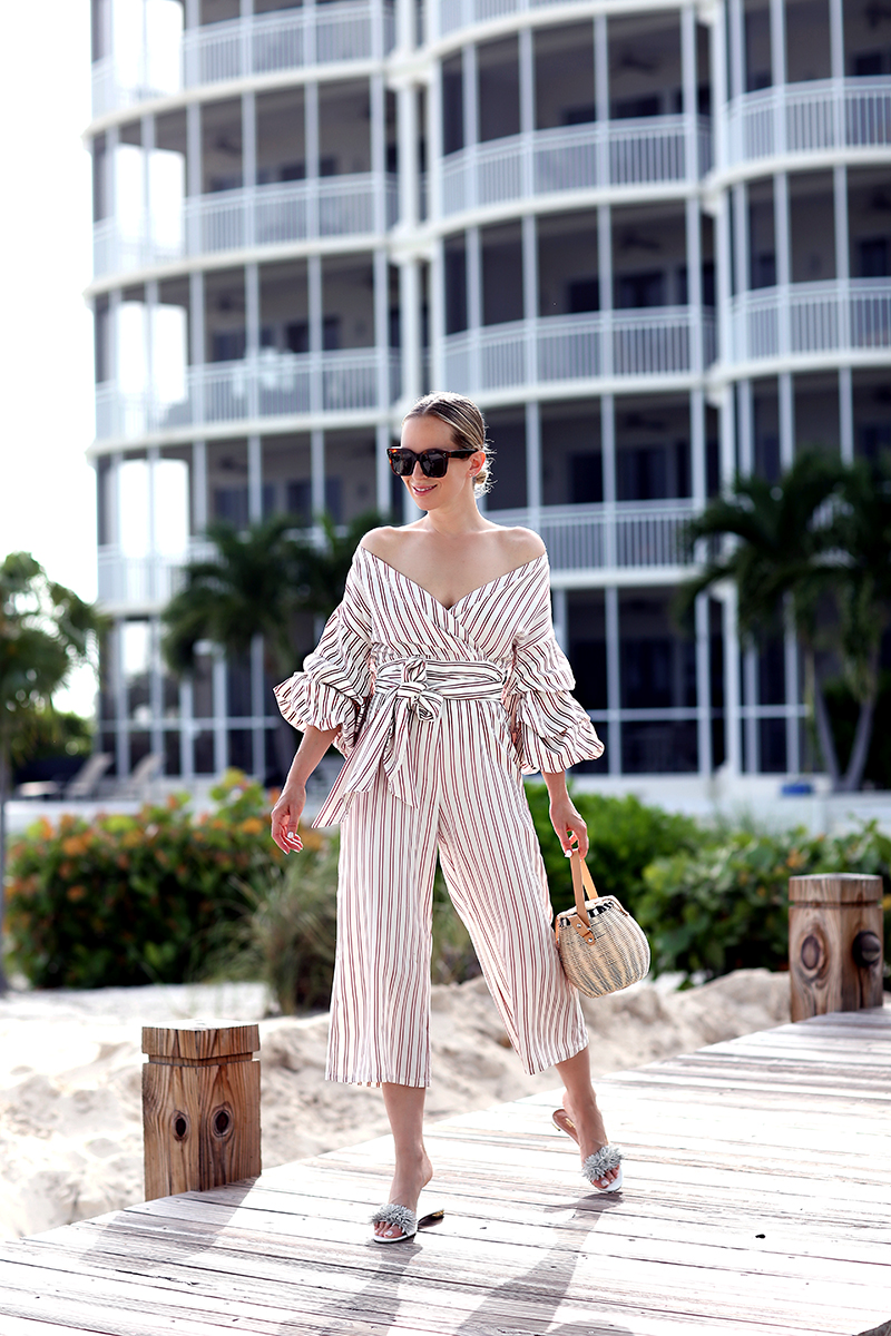 Helena Glazer of Brooklyn Blonde wearing Alexis Jumpsuit, Aquazzura Wild Thing Slides, Basket bag, Celine Sunglasses