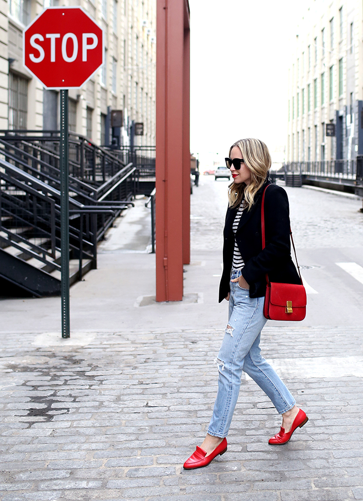 Chic Mom Outfits woman wearing pants, stripped shirt, and red shoes