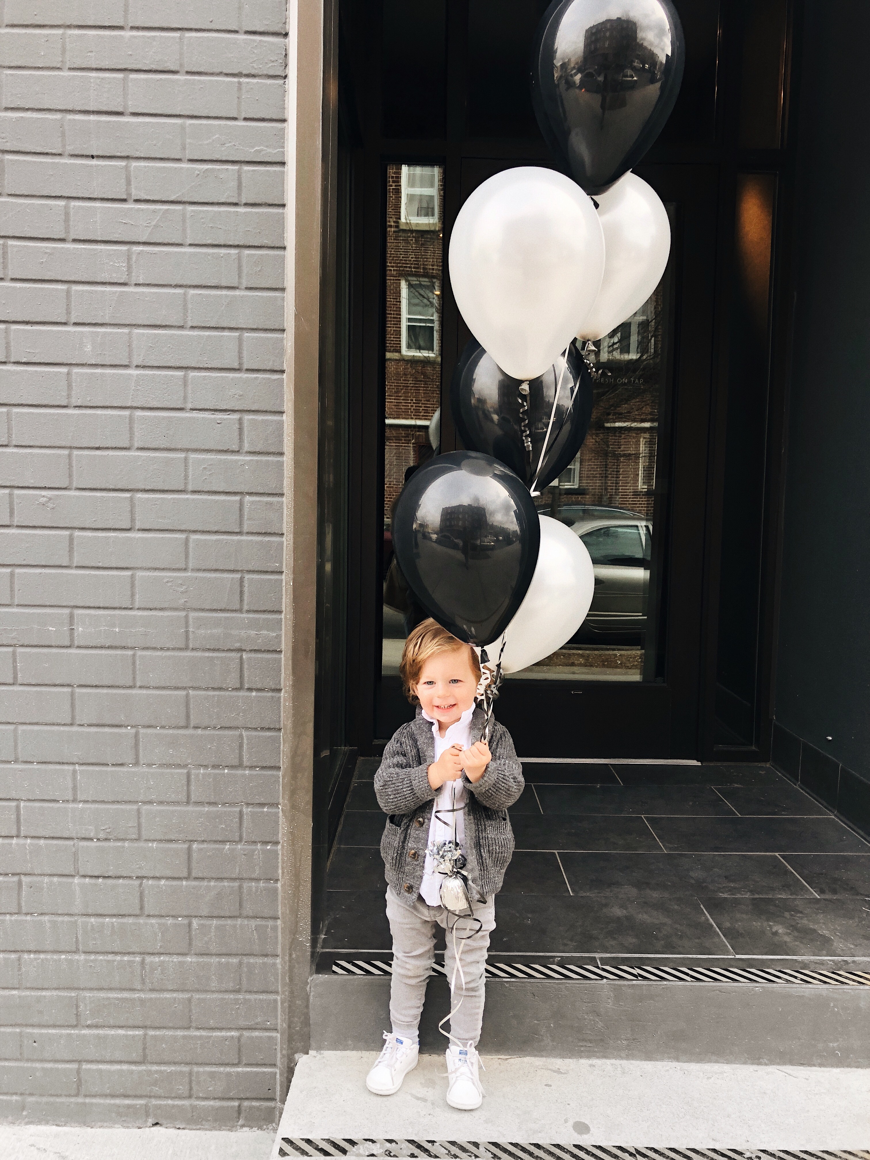 nate is two with balloons 