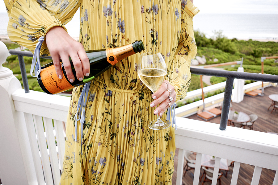 Helena of Brooklyn Blonde drinking Veuve Clicquot Summer Beverage and sharing the secret to happiness 