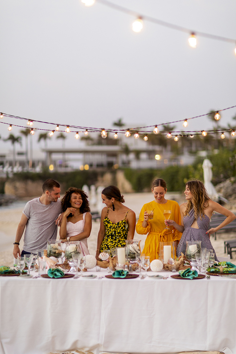 people at the Four Seasons Anguilla and dining at the shore