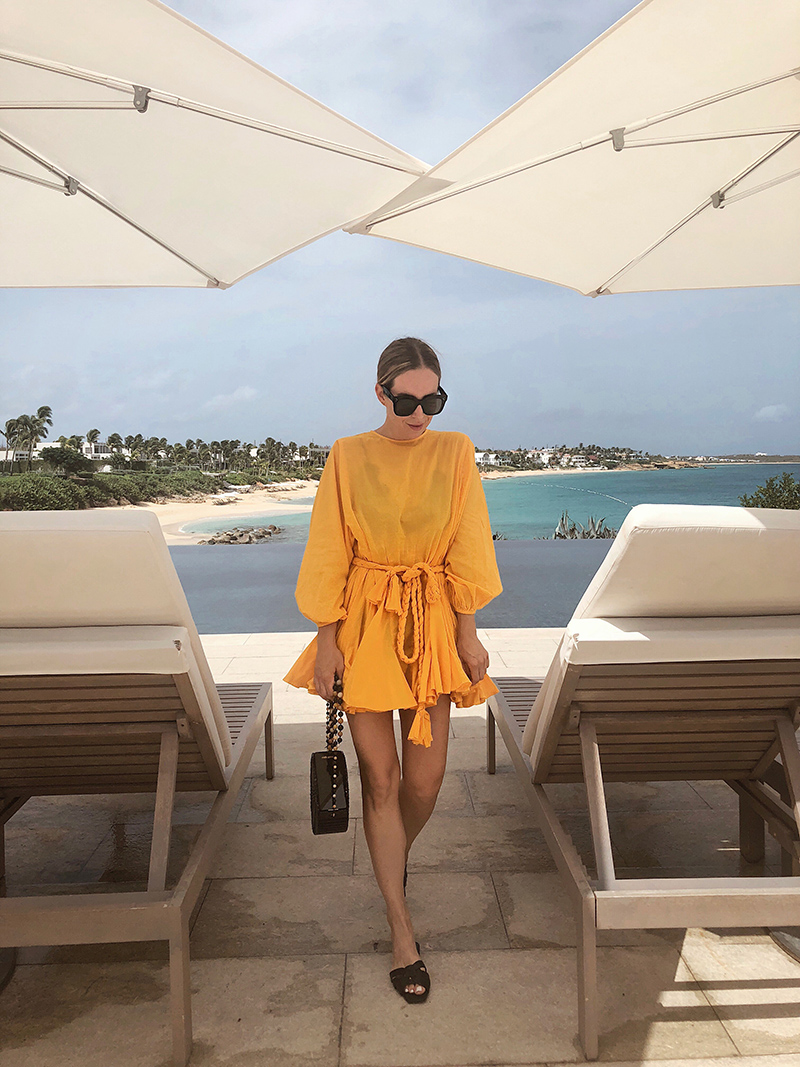 NetsJets x Anguilla Photo Diary where Helena of Brooklyn Blonde is in Rhode Yellow Dress