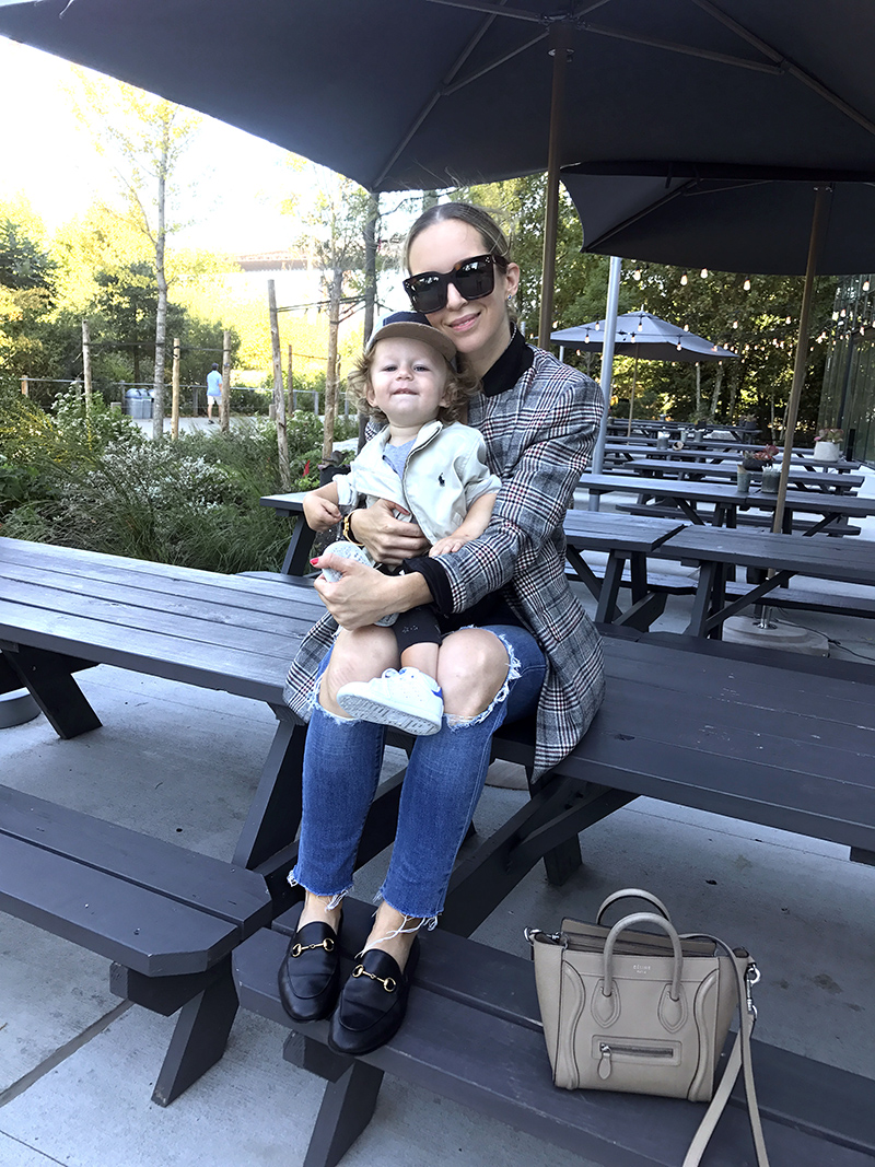 woman sitting on a table with her child 