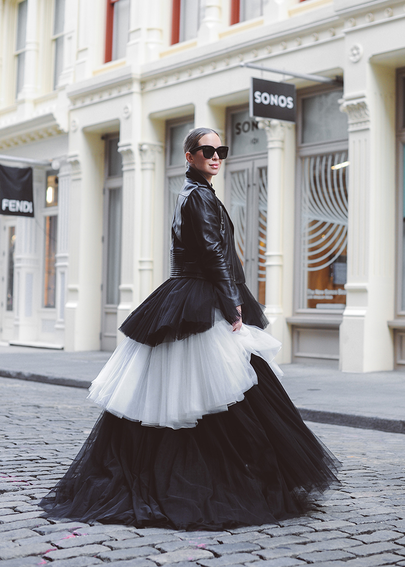 woman in black and white dress for Posting Schedule