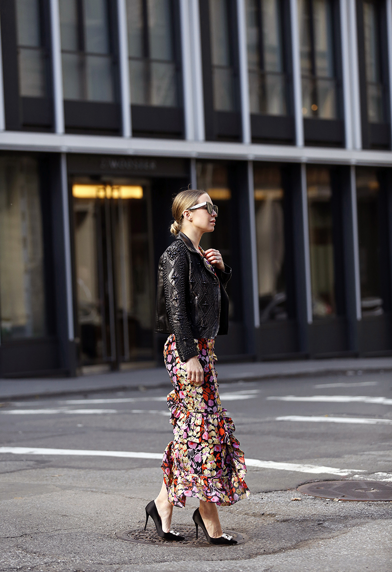 woman in dress and leather jacket