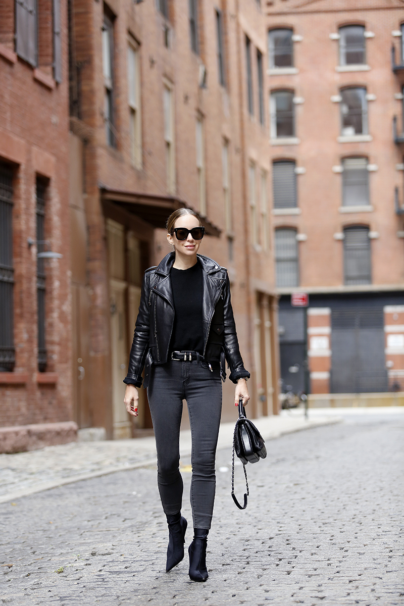 woman wearing all black outfit including Cashmere Classic black top