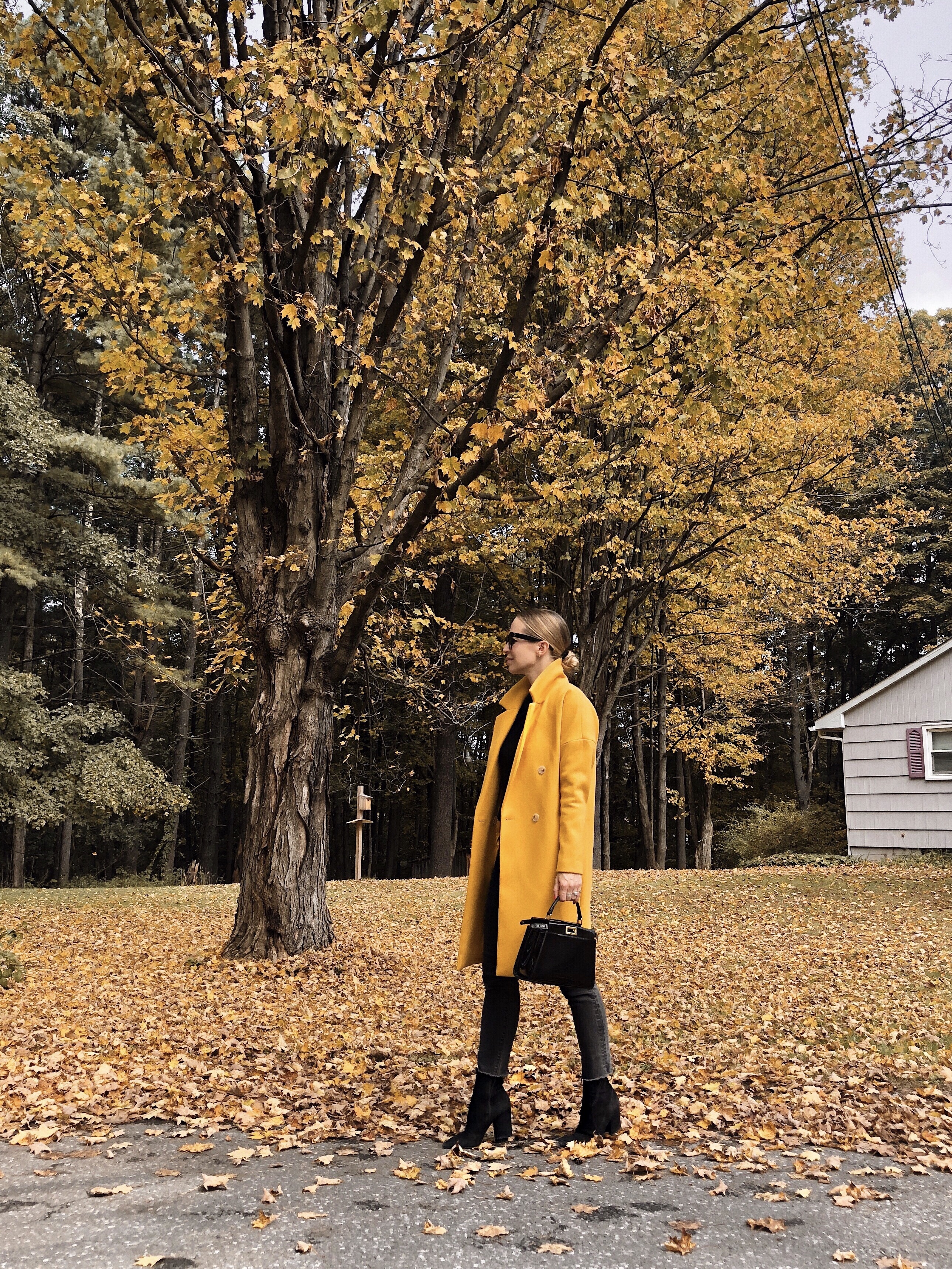 happy friday woman wearing yellow coat