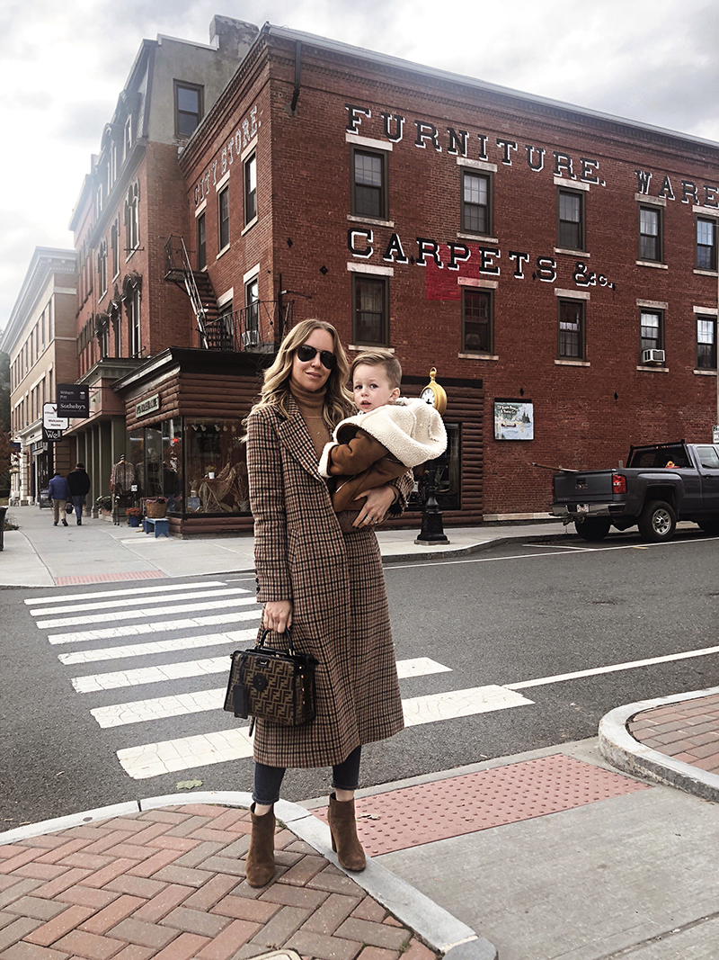 woman carrying her kid for happy friday