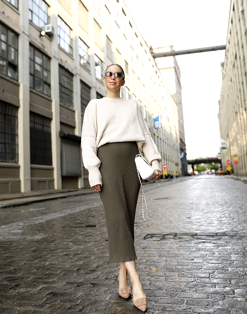 Outfit details: Free People Olive Lulu Henley Midi Dress, Free People White Easy Street Tunic Sweater, Manolo Blahnik Mule Slides by Helena of Brooklyn Blonde