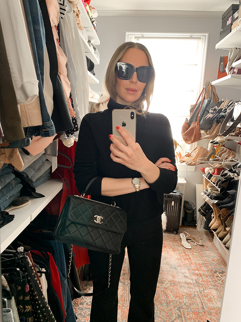 woman taking a selfie inside her walk-in closet