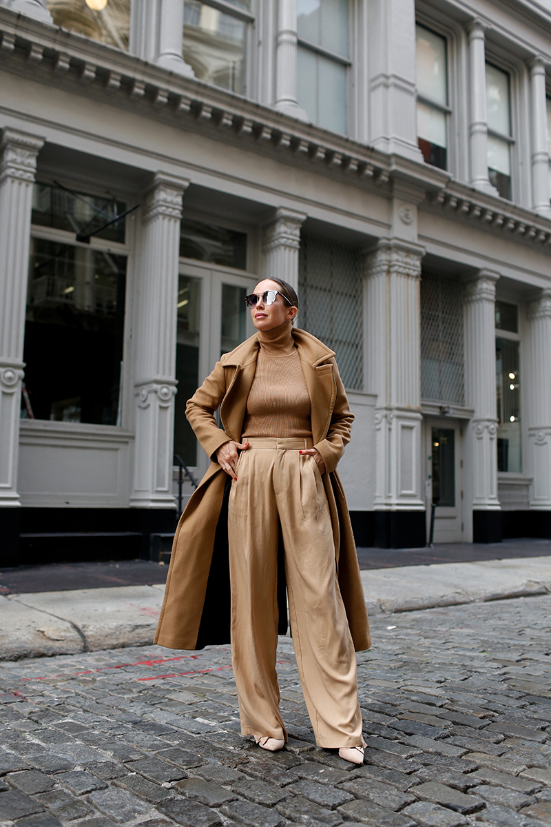 woman posing at the middle of the street 