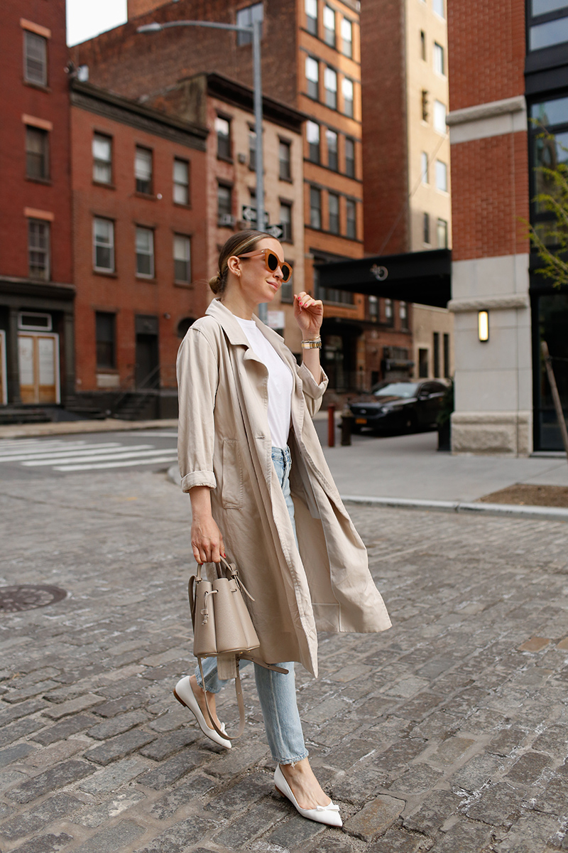 woman wearing her favorite Pairs of Denim, a coat, and white flats