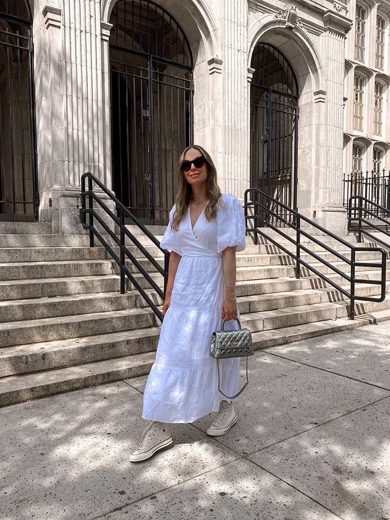 woman wearing white dresses with converse