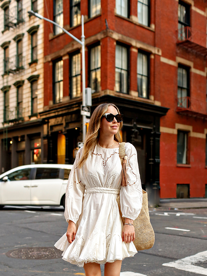 woman wearing white dress and sunglasses 