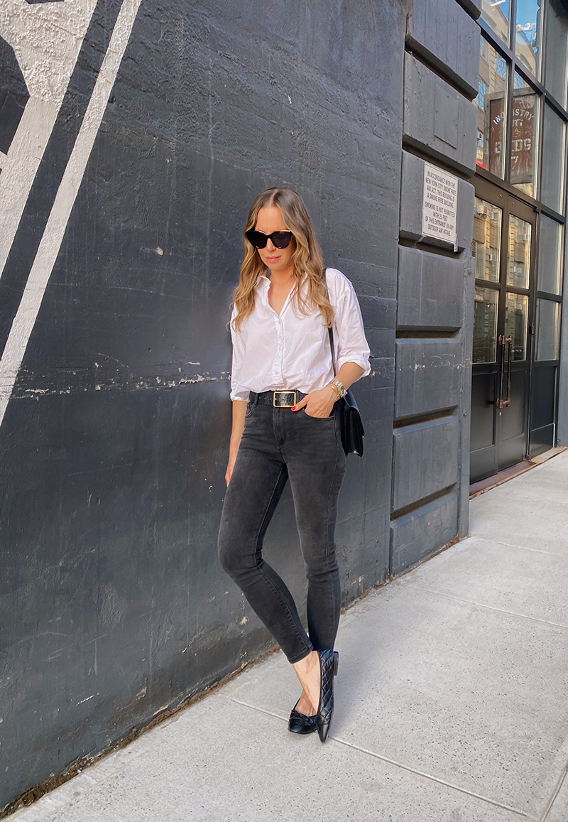 woman sharing pieces I've been wearing with white top and black pants 