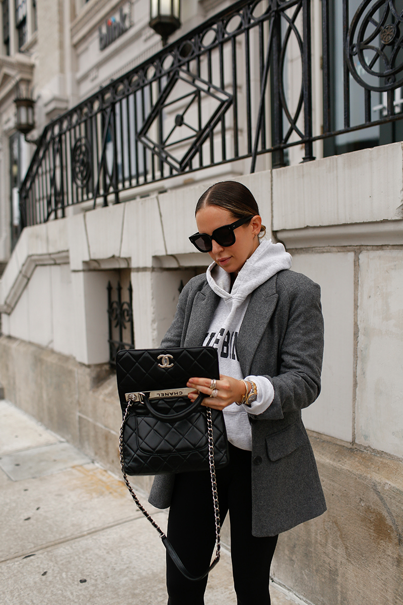 woman holding Channel bag