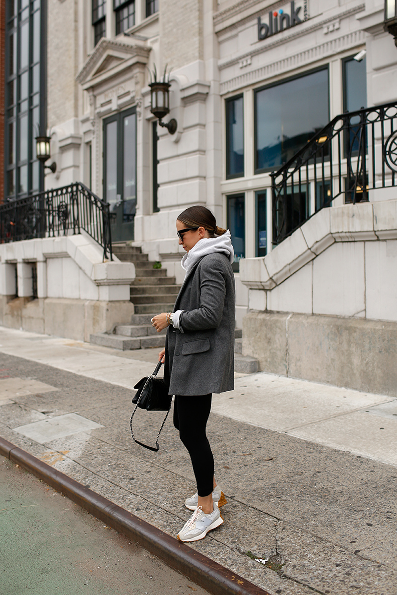 woman in grey coat and leggings 