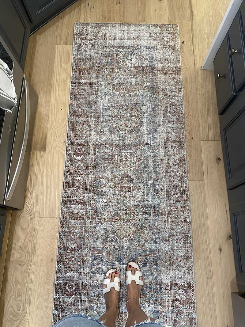 woman stepping on a rugs