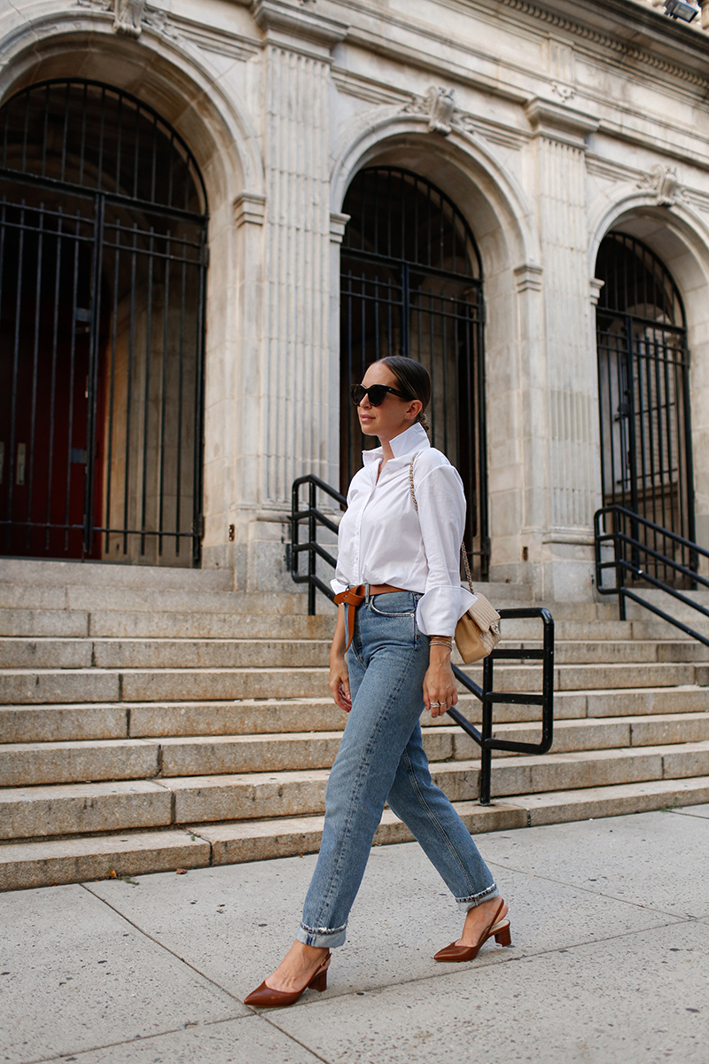 woman wearing denim jeans and white top and sharing Denim Roundup