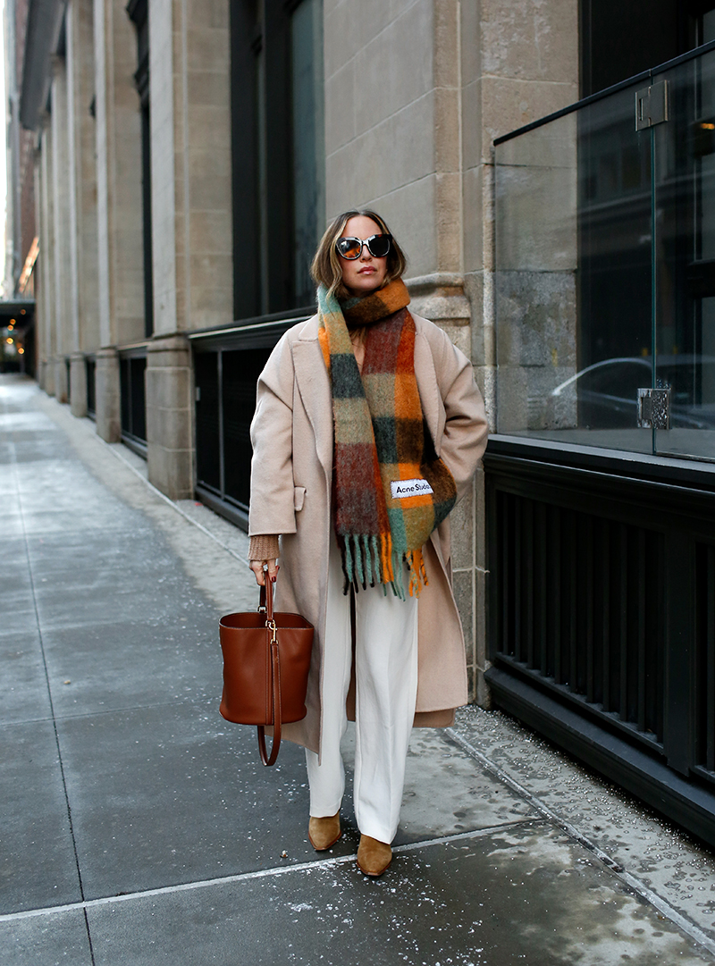 woman sharing Winter Wear with plaid scarf 