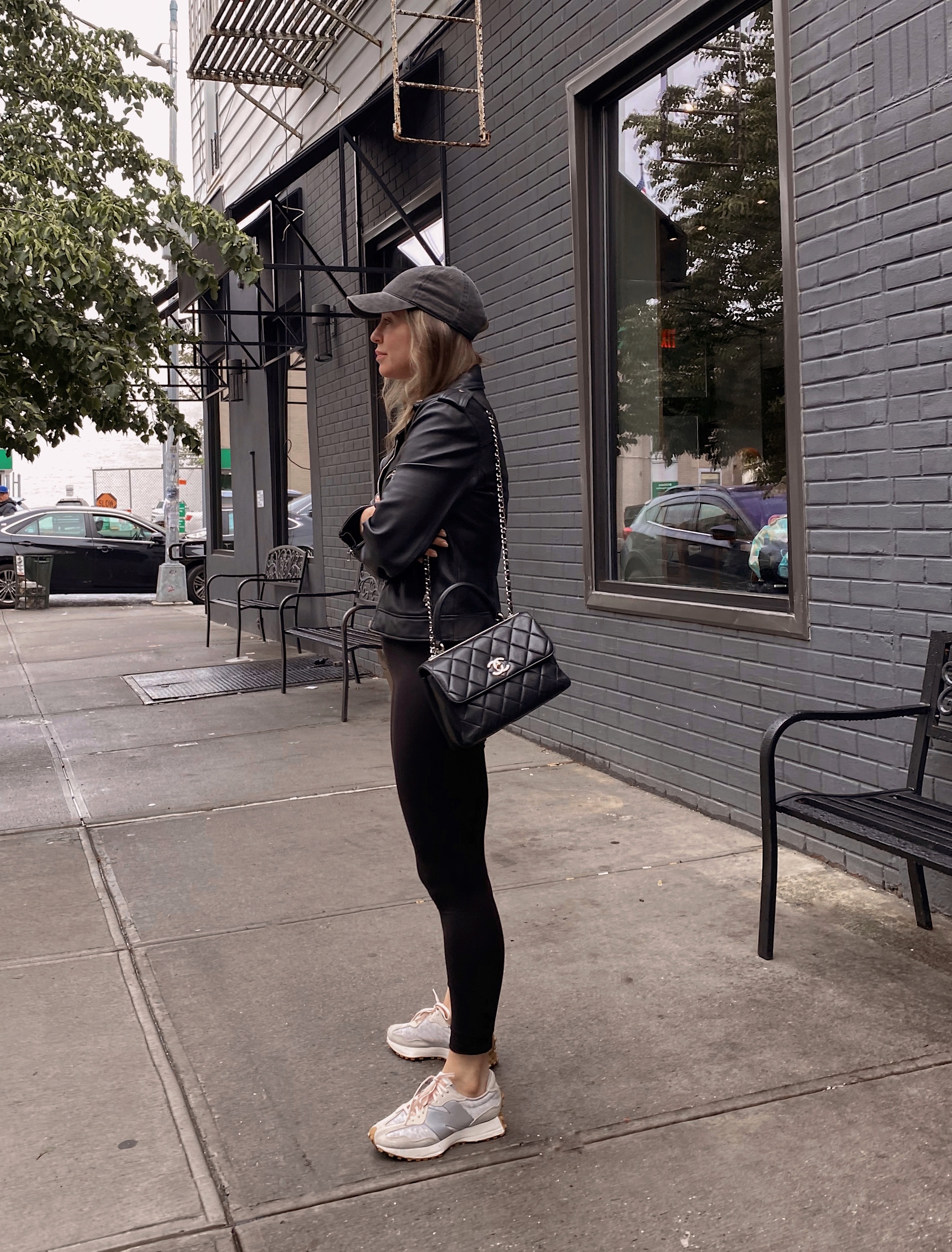 woman in leggings and leather jacket