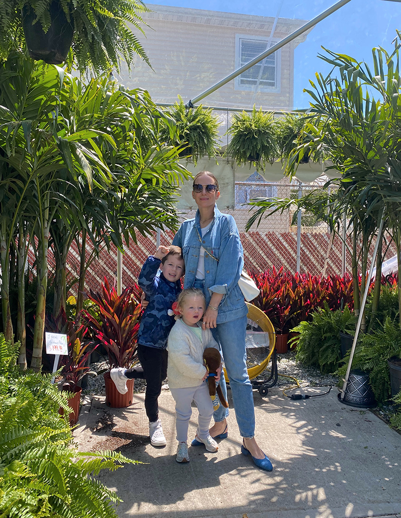 woman in denim jeans and jacket as Mom-Friendly Outfits with her two children