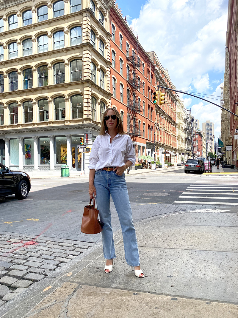 woman wearing st laurent mules for Ten Splurge-Worthy Buys