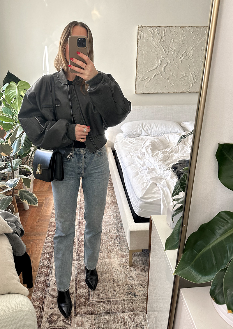 woman in black shirt, leather jacket, and denim jeans for A Week in Outfits