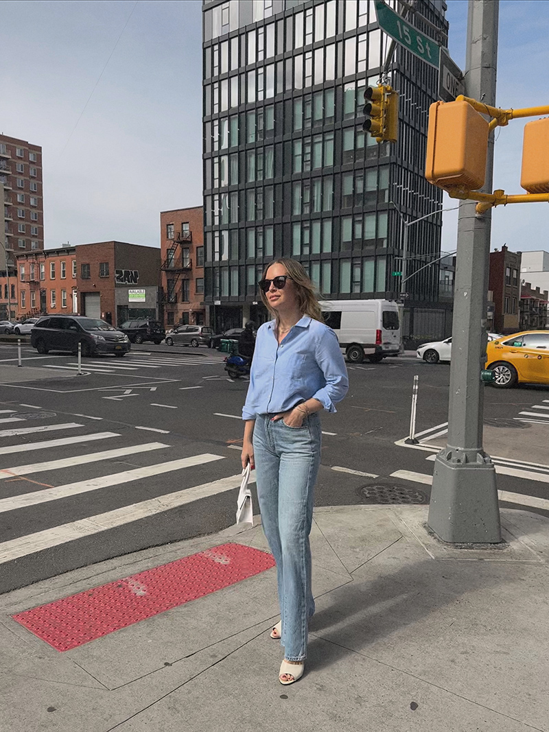 woman in denim jeans and The Tomboy Shirt one of the Three Transitional Looks with Sézane 