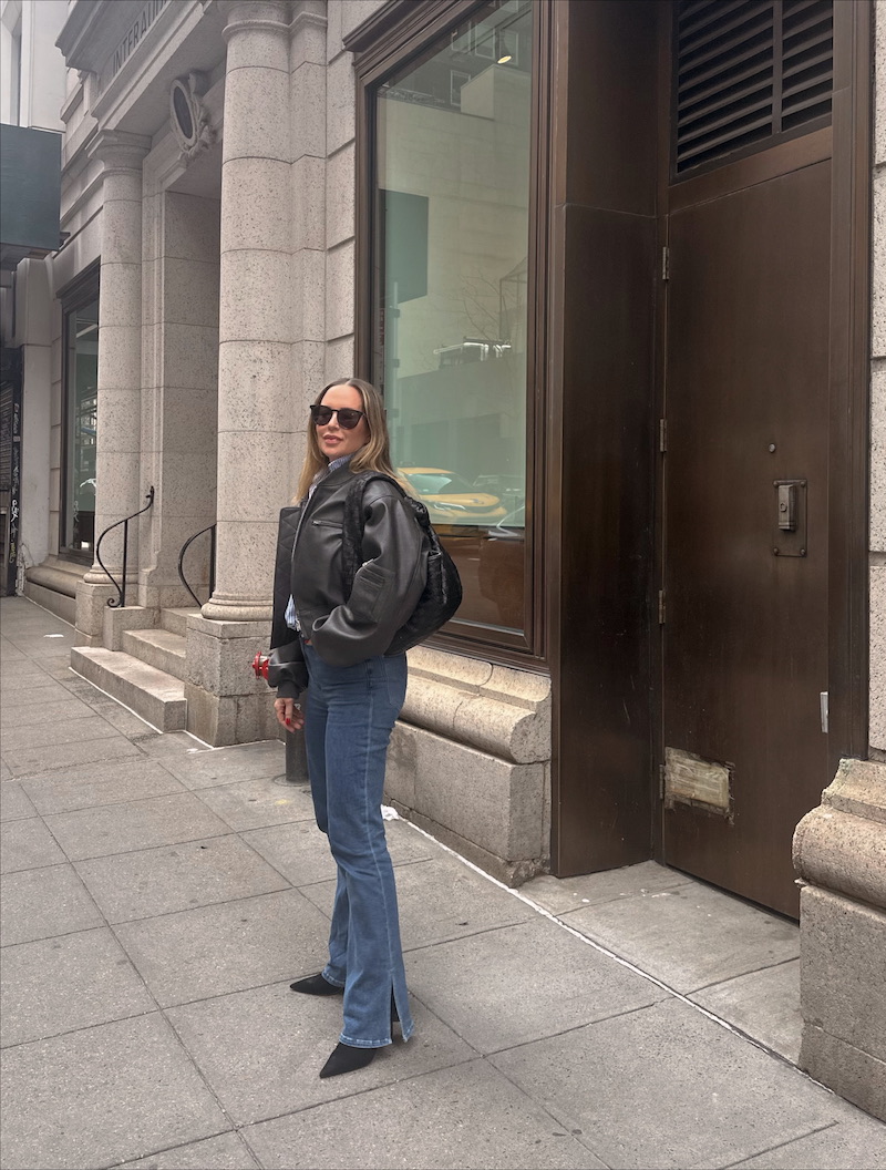 woman in leather jacket and denim jeans 